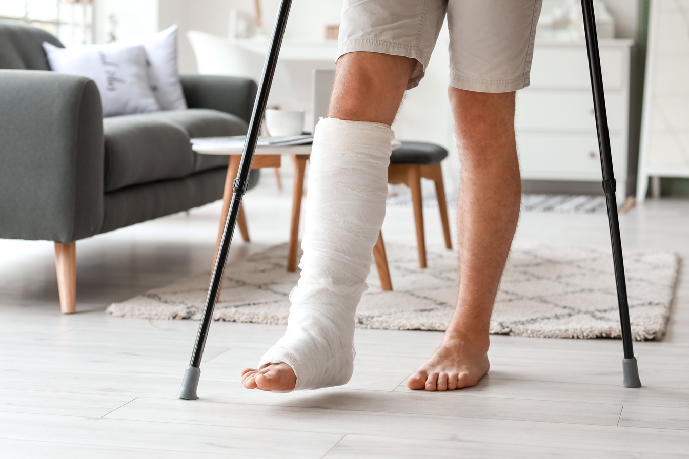 Young Man with Broken Leg at Home